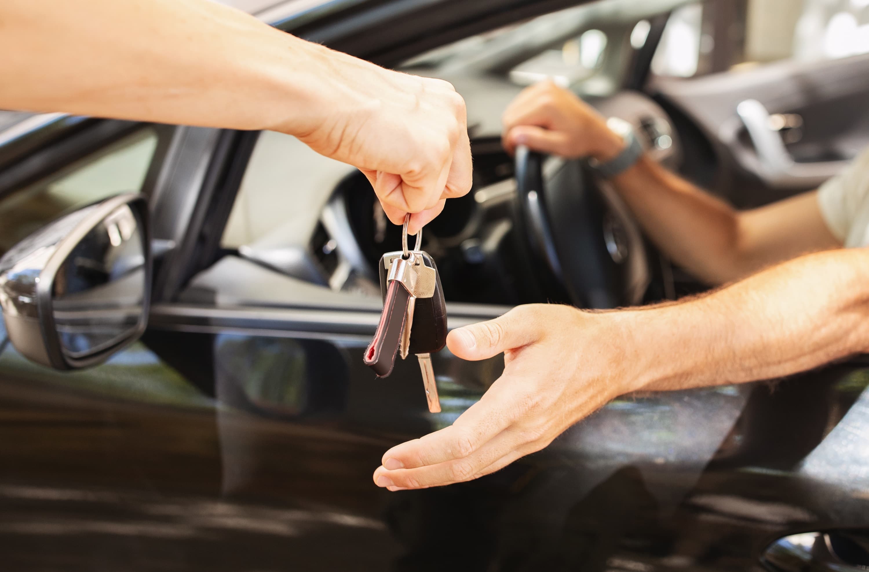 A Handled driver collecting a customer's key for pickup