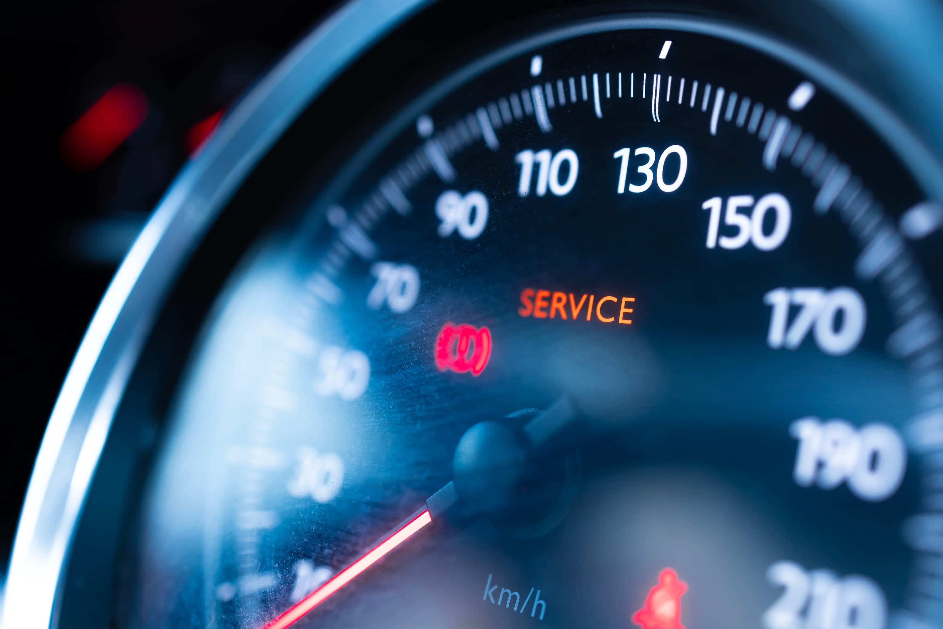 A lit service indicator on a car's instrument cluster